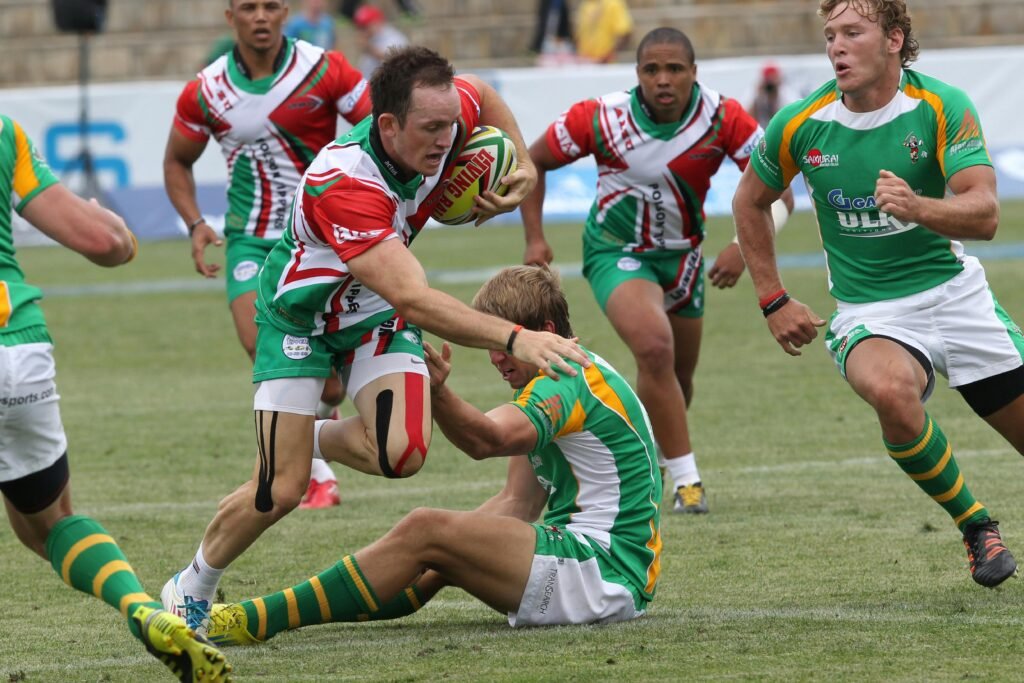 Rugby players in action during a competitive outdoor match.
